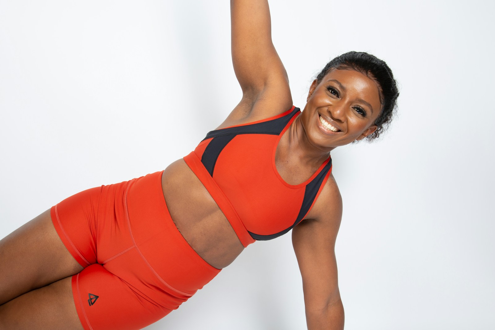 Illustrative lifestyle photograph of a woman exercising; photo by April Laugh on Unsplash